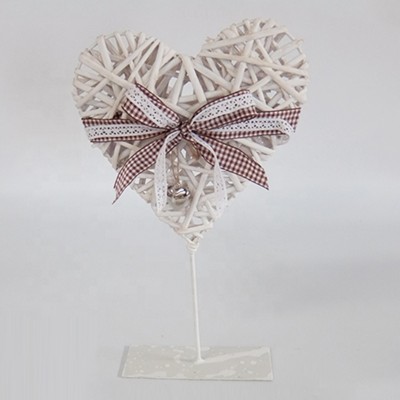 wicker heart decoration with pedestal , ribbon and wooden heart